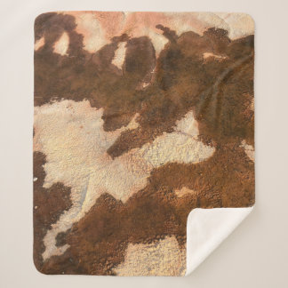 Brown and white floral textile sherpa blanket