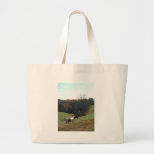 Brown and white horse at autumn pond large tote bag
