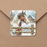 Brown and White Horse Country Christmas   Square Sticker<br><div class="desc">Pretty festive personalized Christmas stickers. A pretty brown and white horse standing behind an old rustic wood fence with a snowy background and vintage old red barn. The snow-filled fence is adorned with illuminated Christmas lights to give a warm festive feel to your country Christmas stickers sealers for your Christmas...</div>