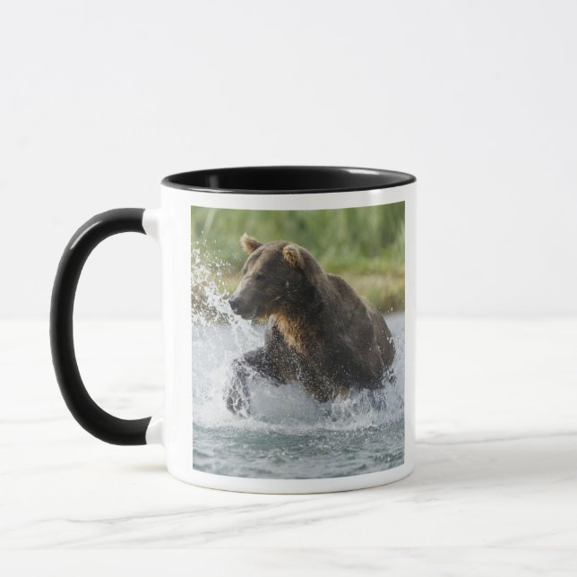 Brown Bear chasing salmon in river Mug (Left)