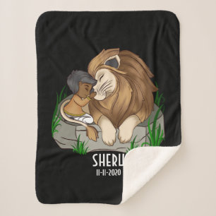 Brown boy hugging a lion sherpa blanket