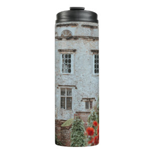 BROWN BRICKED HOUSE NEAR RED FLOWERS THERMAL TUMBLER