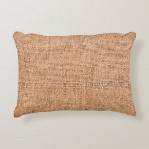 Brown burlap laying on white sheet. Abstract backg Accent Pillow