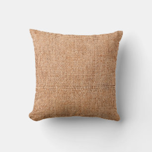 Brown burlap laying on white sheet. Abstract backg Throw Pillow