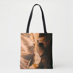 Brown cave under clear sky tote bag