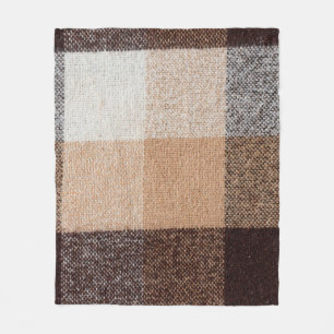 Brown chequered wool plaid fabric texture. tartan  fleece blanket