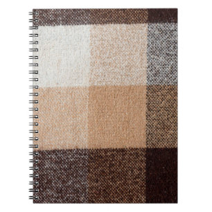 Brown chequered wool plaid fabric texture. tartan notebook