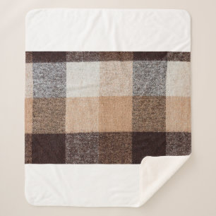 Brown chequered wool plaid fabric texture. tartan  sherpa blanket