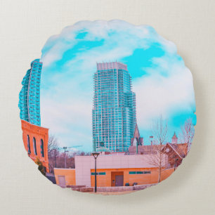 BROWN CONCRETE BUILDING NEAR BARE TREES UNDER BLUE ROUND PILLOW