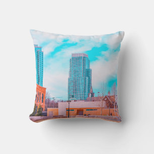 BROWN CONCRETE BUILDING NEAR BARE TREES UNDER BLUE THROW PILLOW