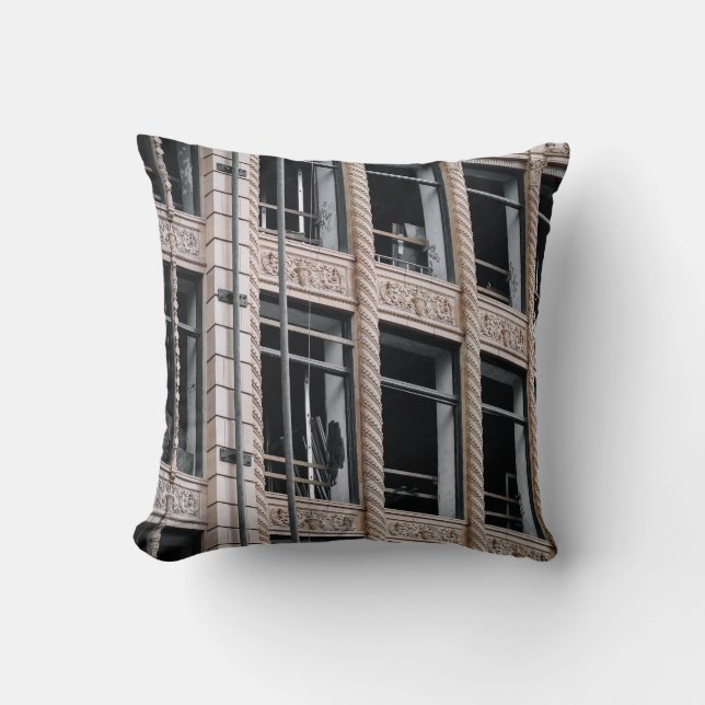 BROWN CONCRETE BUILDING WITH GLASS WINDOWS THROW PILLOW (Front)