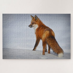 Brown fox walking on snow jigsaw puzzle