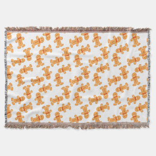 Brown gingerbread man on white throw blanket
