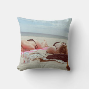 Brown glass bottle across two women throw pillow