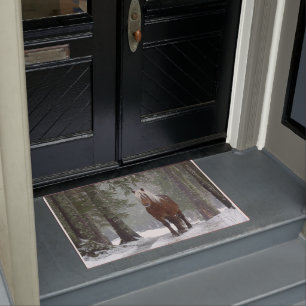 Brown Horse in a Winter Forest with Snow Falling Doormat