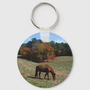 Brown horse with fall trees keychain