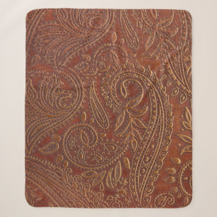 Brown leather, tooled floral pattern. sherpa blanket