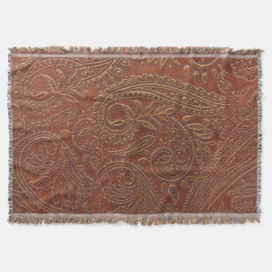 Brown leather, tooled floral pattern. throw blanket