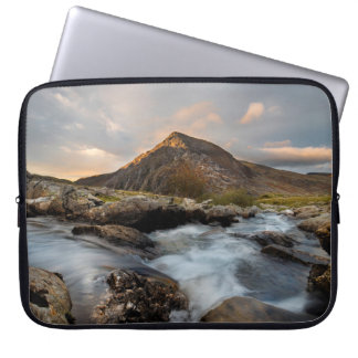 BROWN MOUNTAIN NEAR BODY OF WATER UNDER CLOUDY SKY LAPTOP SLEEVE