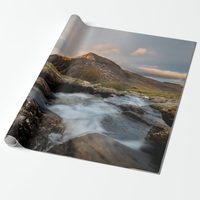 BROWN MOUNTAIN NEAR BODY OF WATER UNDER CLOUDY SKY WRAPPING PAPER (Unrolled)