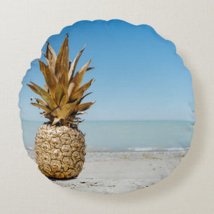 Brown pineapple fruit on seashore round pillow