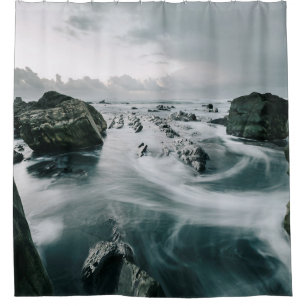 BROWN ROCK AND CLIFF SURROUNDED BODY OF WATER
