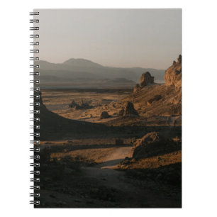 BROWN ROCK FORMATION ON BROWN FIELD DURING DAYTIME NOTEBOOK