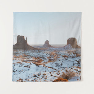 BROWN ROCK FORMATION ON WHITE SNOW COVERED GROUND TAPESTRY