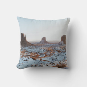 BROWN ROCK FORMATION ON WHITE SNOW COVERED GROUND THROW PILLOW