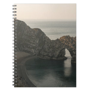BROWN ROCKY MOUNTAIN BESIDE BODY OF WATER DURING D NOTEBOOK
