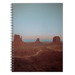 BROWN ROCKY MOUNTAINS AND FIELD DURING DAY NOTEBOOK