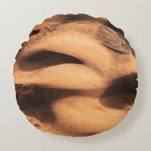 Brown sand formation round pillow