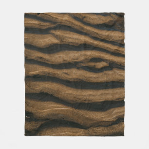 Brown sand with footprints during daytime fleece blanket