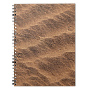 Brown sand with water during daytime notebook