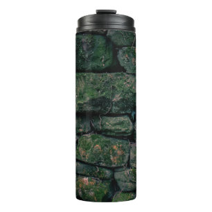 Brown vines on stacked stone blocks thermal tumbler