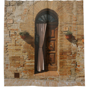 BROWN WOODEN DOOR ON BROWN BRICK WALL