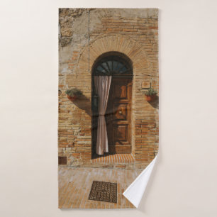 BROWN WOODEN DOOR ON BROWN BRICK WALL BATH TOWEL