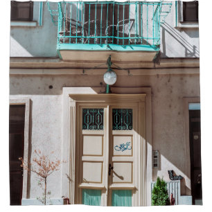 Brown wooden door on white concrete building
