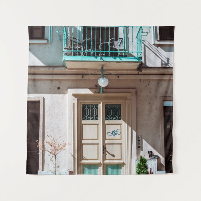 Brown wooden door on white concrete building tapestry (Front)