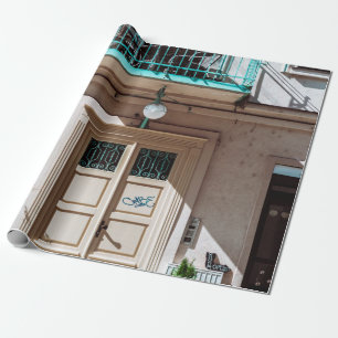 Brown wooden door on white concrete building wrapping paper