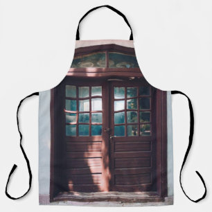BROWN WOODEN WINDOW ON BLUE CONCRETE WALL APRON