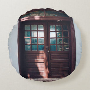 BROWN WOODEN WINDOW ON BLUE CONCRETE WALL ROUND PILLOW