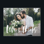 Brush Script Love & Thanks Photo Wedding Thank You Postcard<br><div class="desc">Thank your friends and family for attending your wedding in style with our modern wedding thank you postcard. The postcard displays your favourite horizontal wedding photo with "Love & Thanks" in a white, brush script overlay. Personalize the wedding thank you postcard by adding your names on the front. The postcard...</div>