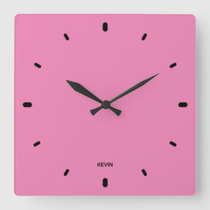 Bubble gum pink clock face and black hours numbers