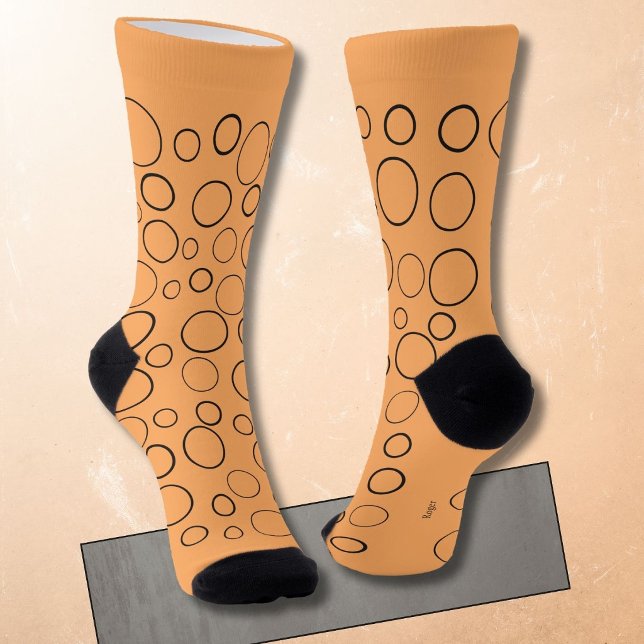 Bubbles and rings, black circles on orange socks (Creator Uploaded)