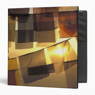 Buddhist prayer flags in the sunset, binder