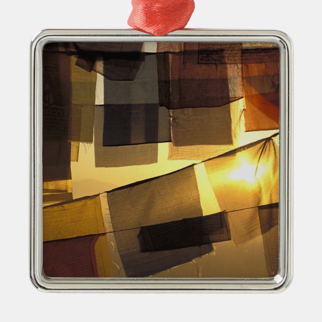 Buddhist prayer flags in the sunset, metal ornament (Front)