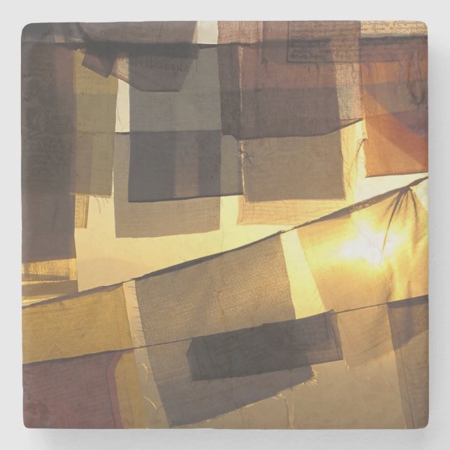 Buddhist prayer flags in the sunset, stone coaster (Front)