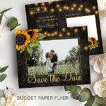 Budget rustic sunflower wedding save the date flyer<br><div class="desc">Yellow orange sunflowers and strings of twinkle lights on dark brown elegant barn wood custom photo save the date BUDGET affordable wedding postcard FLYER. Easy to personalize with your names and text! Suitable for floral summer or autumn fall / garden backyard rustic country or farmhouse themed weddings. PLEASE READ THIS...</div>