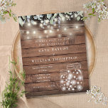 Budget Rustic Wood Lights Mason Jar Wedding Invite<br><div class="desc">A stylish budget wedding invitation featuring pretty string lights,  mason jars and sage and lilac leaves that tumble over a rustic wood background. Designed by Thisisnotme©</div>